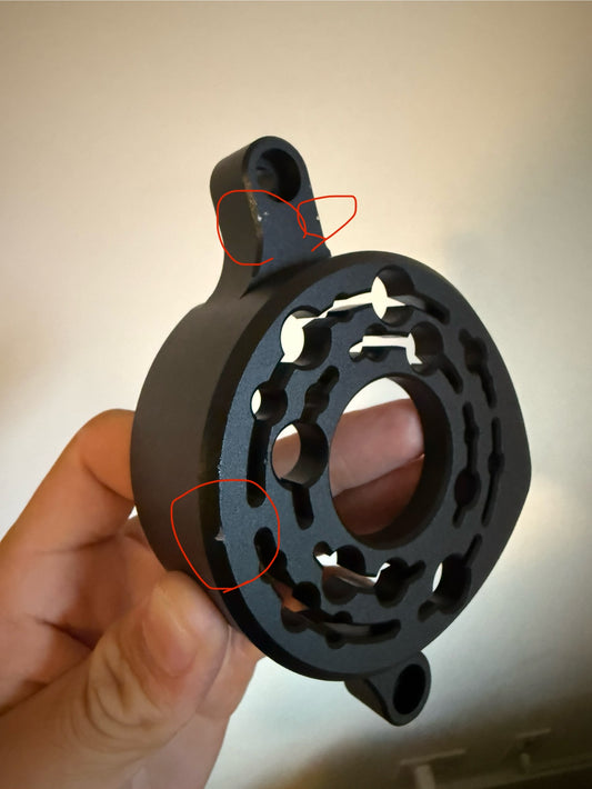 Scratched black metal motor cover