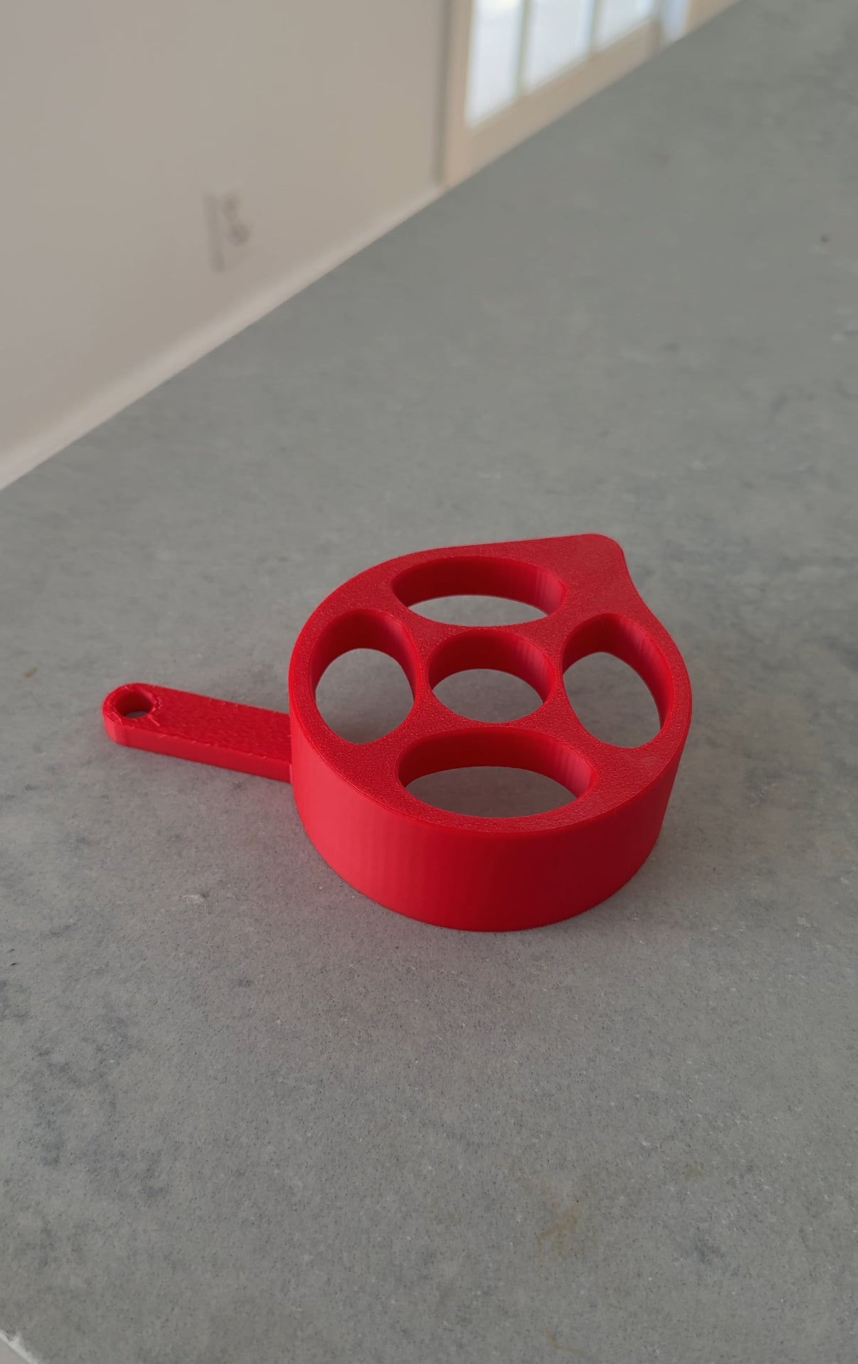 Red talaria xxx motor cover in plastic shown from top view